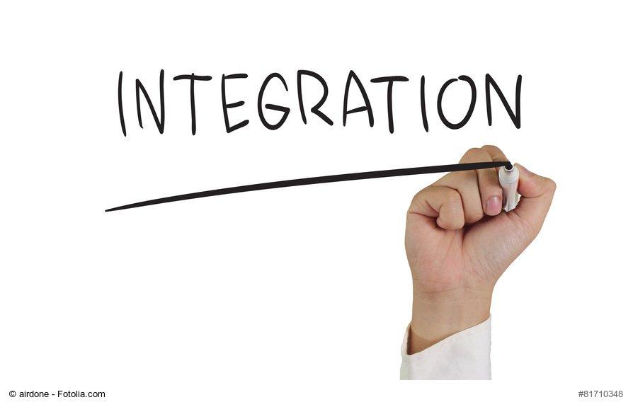 Business concept image of a hand holding marker and write Integration isolated on white