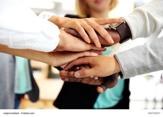 Business people joining hands 