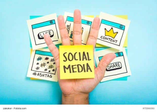 Social media on hand with blue background 