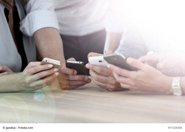 Closeup on smarphones being used in office 