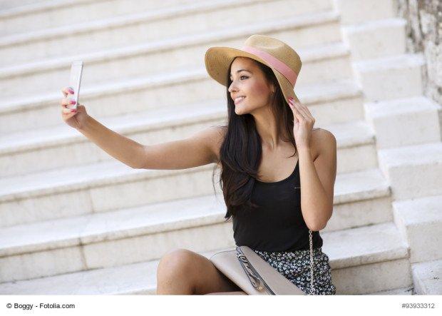 Young woman taking selfie outdoor 