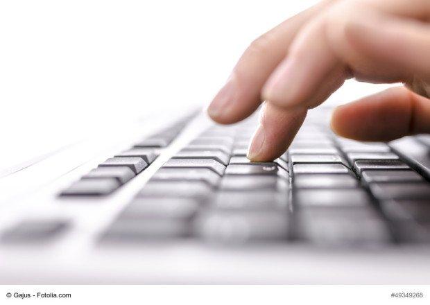 Business woman typing on keyboard. Shallow dof. 