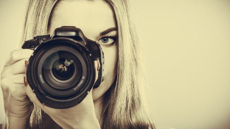 Photographer girl shooting images