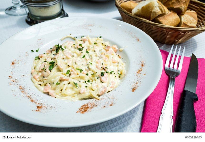 tasty pasta with salmon on a the table