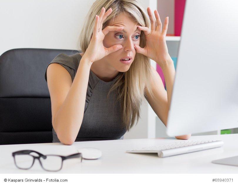 Tired and exhausted woman at work