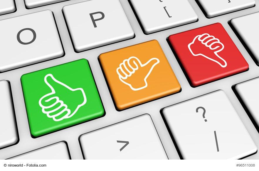 Business quality service customer feedback, rating and survey keys with hands thumb up symbol and icon on computer keyboard.
