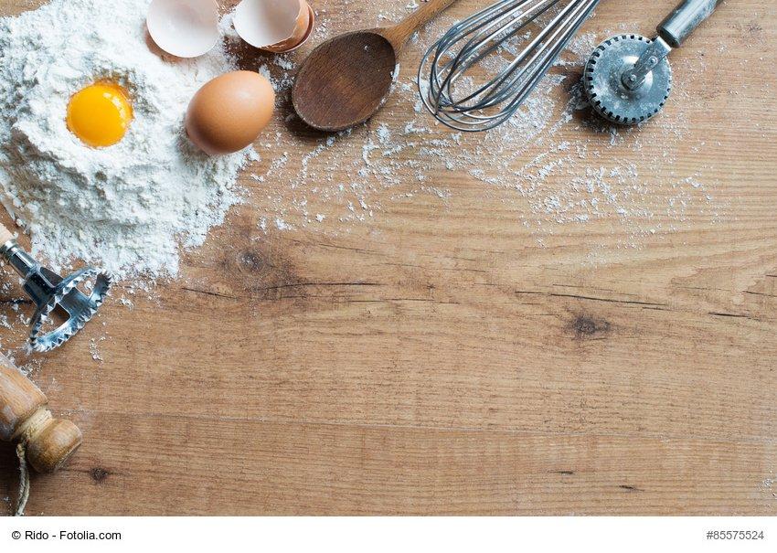 Fresh ingredients and cooking utensils on rustic table