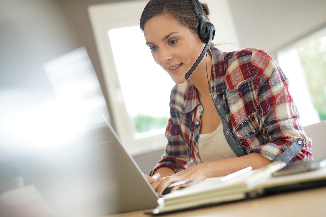 Customer service representative working from home on laptop