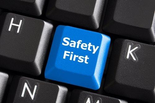 safety first concept with blue key on computer keyboard